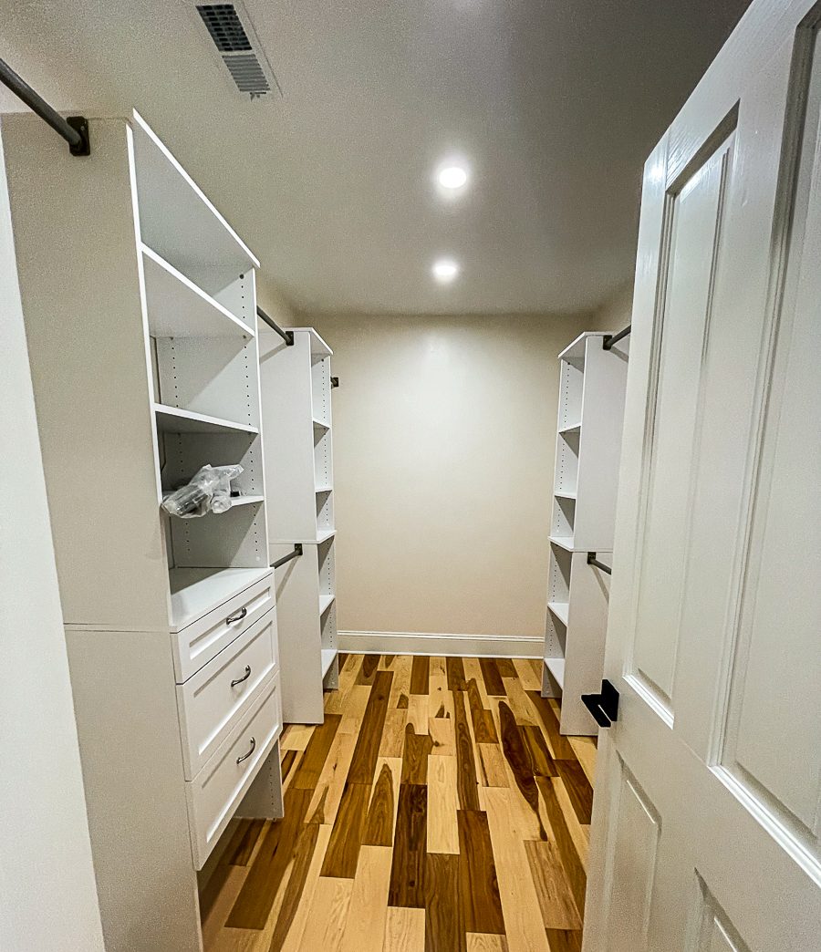 Walk in closet with built in shelving on both sides, built by Sidney Design & Build in Winchester, VA